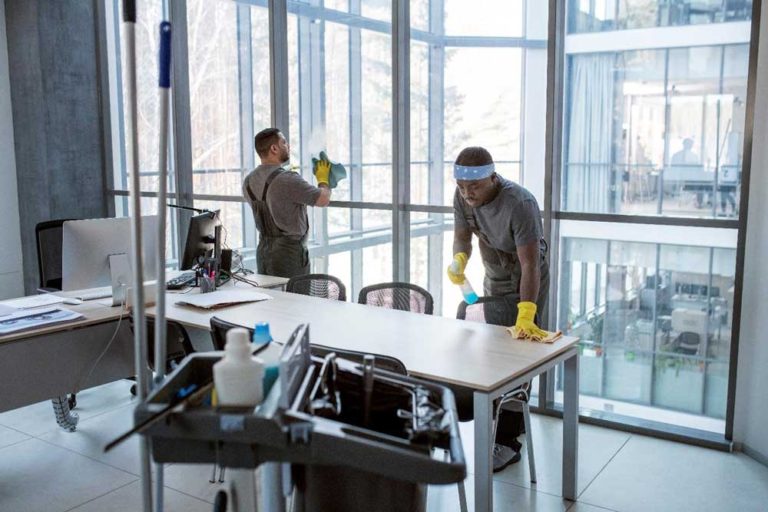 two men cleaning an office